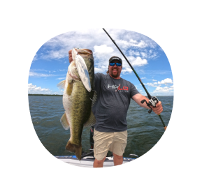 a person holding a large fish and a fishing rod